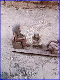 Ancient egyptian antique wooden figurine group depicting daily life social scene