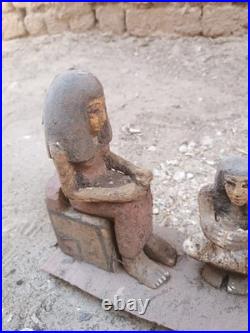 Ancient egyptian antique wooden figurine group depicting daily life social scene