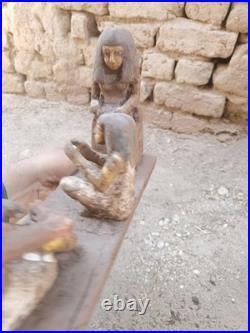 Ancient egyptian antique wooden figurine group depicting daily life social scene
