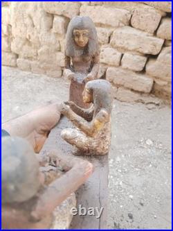 Ancient egyptian antique wooden figurine group depicting daily life social scene