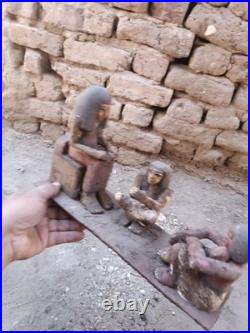 Ancient egyptian antique wooden figurine group depicting daily life social scene