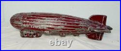 Antique 1920's original AC Williams red Graf Zeppelin cast iron coin still bank