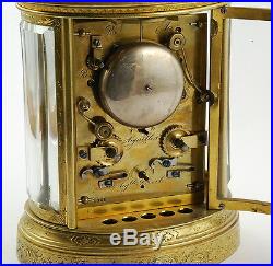 Antique 19th Century French repeating carriage alarm clock, gilt brass, oval