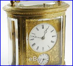 Antique 19th Century French repeating carriage alarm clock, gilt brass, oval