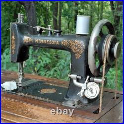 Antique Minnesota Model D Treadle Sewing Machine Oak Cabinet Cast Iron Base Antique Minnesota Model D Treadle Sewing Machine Oak Cabinet Cast Iron Base