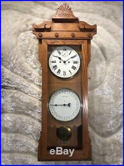 Antique Oak USA 30 Day New Haven Double Dial Calendar Wall Clock W Pendulum