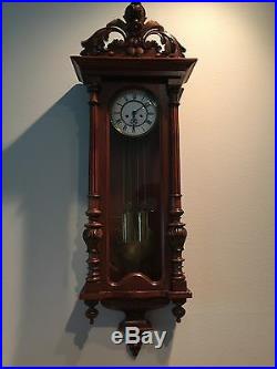 Antique clock/Gustav Becker Circa 1885 carved case with tall pendulum with singe