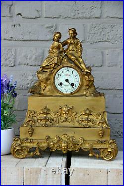 Antique french bronze gold gilt mantel clock Devil putti head couple figurines