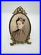 Antique-oval-picture-frame-ornate-brass-scrolling-top-ribbon-accent-01-pblh