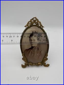 Antique oval picture frame ornate brass scrolling top ribbon accent
