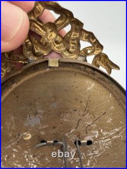 Antique oval picture frame ornate brass scrolling top ribbon accent