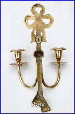 Antique wall candlestick in cast and forged bronze