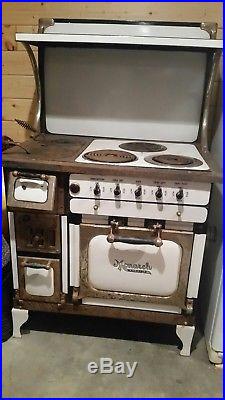 Antique wood and electric cook stove Monarch brand