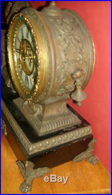 Antique working Victorian ANSONIA iron mantel clock MERCURY. Man seated 1882