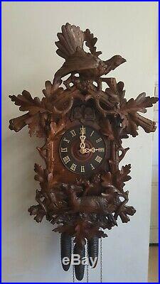 Beautifully carved antique cuckoo clock
