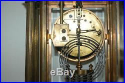 French Antique clock with Marble Base, Glass Doors, and Brass Columns