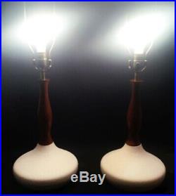 Pair of Mid Century lamps. Ceramic and teak wood. 3-way switch. Handsome Danish