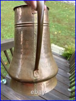 Vintage or antique hand-hammered copper jug or pitcher