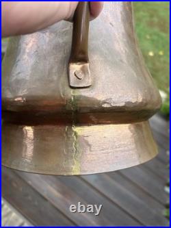 Vintage or antique hand-hammered copper jug or pitcher
