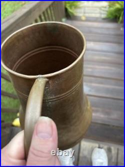 Vintage or antique hand-hammered copper jug or pitcher